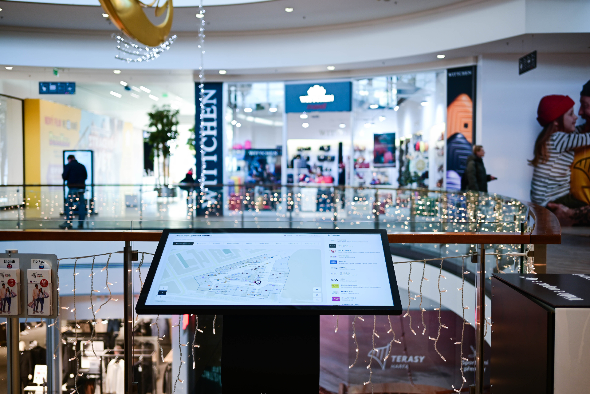Interactive wayfinding kiosk displaying a mall floor plan in a shopping center